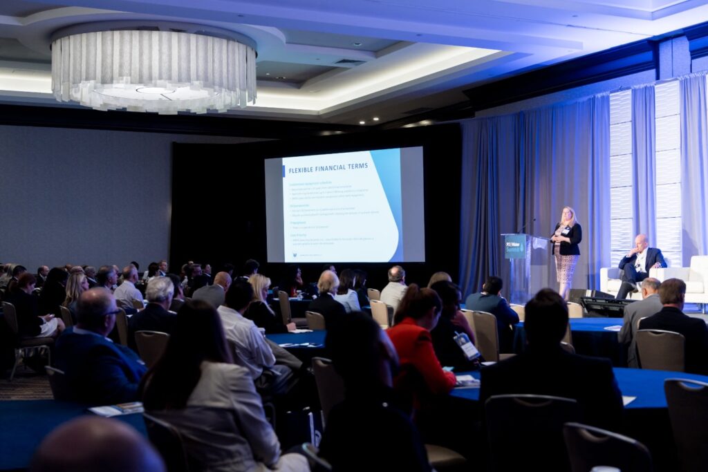 woman presenting a talk on stage